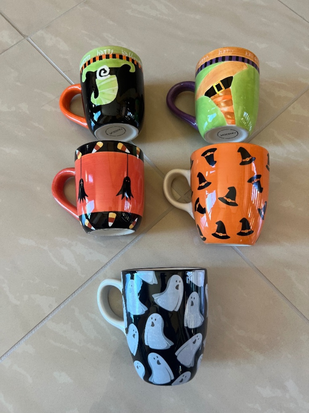 Halloween ceramic mugs featuring various spooky designs